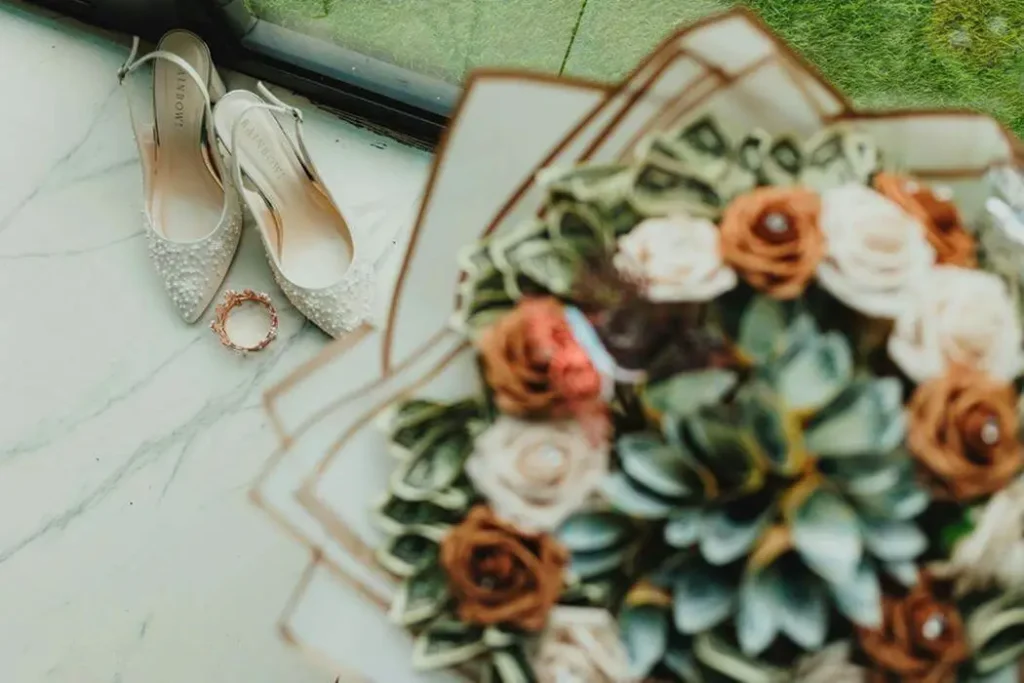 Elegant bride's accessories with succulent bouquet