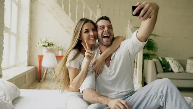 married couple laughing together at home